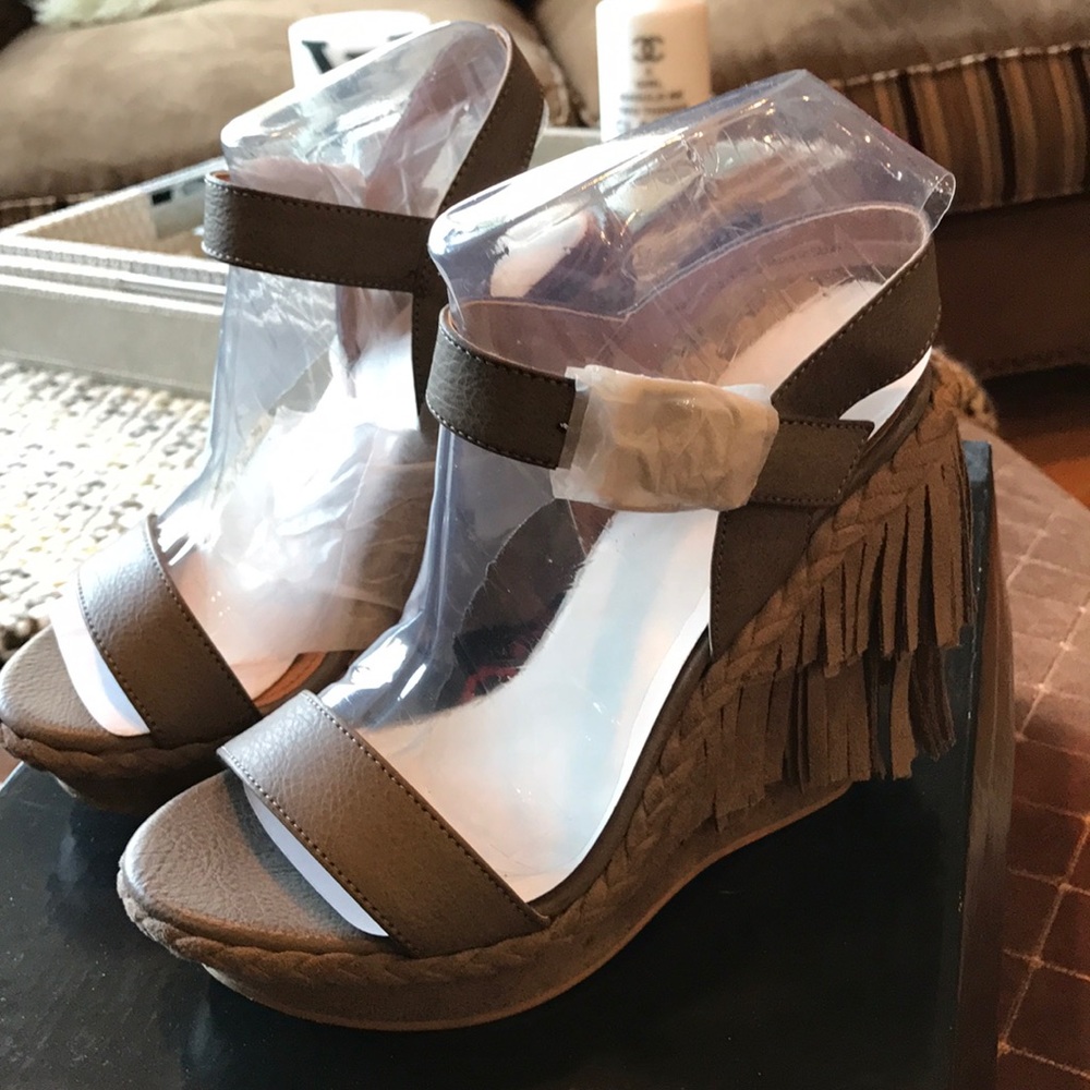 Not Rated Taupe sandals with fringe. Brand new